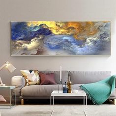 a living room filled with furniture and a painting on the wall above it's couch