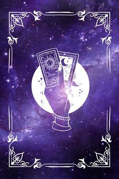 a hand holding two cards in front of a purple background with stars and swirls