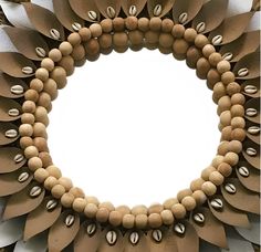 a close up of a wreath made out of wooden beads