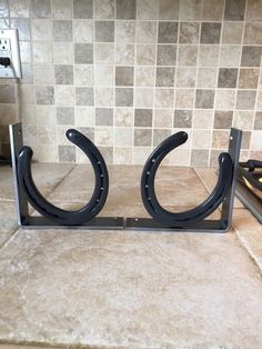 "This listing is for one (2)pair of shelf brackets.  A pair = One Left & One Right Bracket Summer Sale Price Normally $34.95 for this set. At this price they are only $15.00 each. Limited Quantity at this sale Price so get them while they last These horseshoe shelf brackets are great for adding a shelf anywhere you want to display items or keep things handy in the kitchen, bath, utility room or in the tack room. They also allow you to hang something from the horseshoe like a hook.  Each shelf bracket measures 5 1/2\" tall by 5 1/2\" deep and 1 1/4\" wide and is made out of 3/16\" hot roll steel.  Each bracket has four, 3/16\" diameter counter sunk holes drilled to allow attachment to your wall and shelf. I will ship some screws with these brackets. These are a great size to use with 1 x 6 Horseshoe Shelf, Horseshoe Wine Rack, Horseshoe Crafts Projects, Horseshoe Projects, Horseshoe Crafts, Rustic Cabin Decor, Tack Room, Wire Wheel, Metal Art Welded