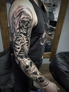 a man with a skeleton tattoo on his arm