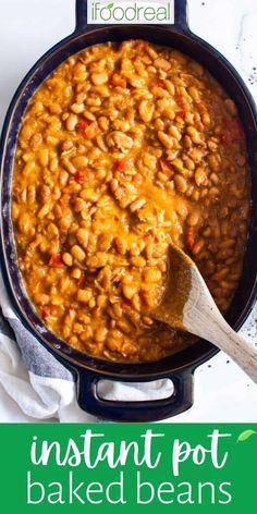 instant pot baked beans in a cast iron skillet with a wooden spoon on the side