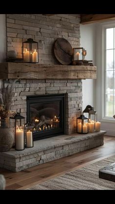 a living room with a fire place filled with candles