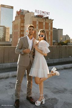 a man and woman posing for the camera