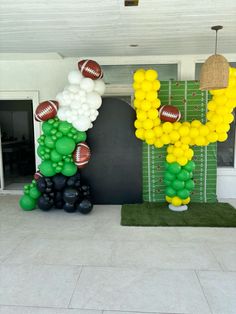 balloons are arranged in the shape of letters and footballs