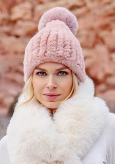 There are beanies, then there's the Blush Poppy Pom Beanie. Hand-knitted of faux fur yarn in a flattering, soft shade of Blush, the Poppy Pom has the perfect amount of body and stretch. Topped with a fun, whimsical 5" fur pom, the roomy 10"-high cap portion slips easily off and on, leaving hair uncrushed. Neutral and easy to style, the Poppy Pom dresses up and down. Make the Poppy Pom your signature accessory, knowing in this case, fabulous-ness is practical as well! The Poppy Pom Beanie is conveniently machine-wash. Create a gift set by adding the matching pull-through scarf (43109) and finger-less gloves (43100). Rest assured, all three pieces have the same convenient easy-care. Fluffy Faux Fur Hat For Cold Weather, Faux Fur Beanie For Fall, Faux Fur Beanie Hats For Fall, Faux Fur Beanie For Cold Weather, Fall Faux Fur Beanie Hat, Warm Faux Fur Beanie, Cold Weather Faux Fur Beanie, Chic Beanie Hat For Winter, Chic Beanie For Winter