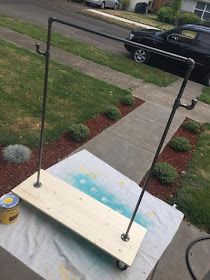 a hot tub sitting on top of a cement slab next to a sidewalk and grass