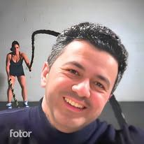 a man smiling in front of an image of a woman doing exercises with her hair