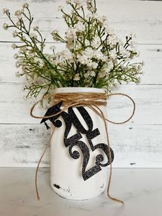 a mason jar with some flowers in it