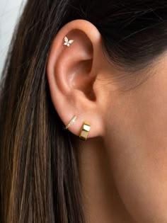 Small but sparkly, these beautiful butterfly stud earrings will just about go with everything. Look gorgeous worn alone to add some sparkle to your ears and also layer beautifully with other dainty earrings for those w Simple Second Ear Piercing, 2 Love Piercings, 3 Ear Piercings Aesthetic, Classy Piercing Ideas, Earring Ideas For 3 Holes Gold, Three Ear Piercings Aesthetic, Cartalige Percinings Ideas, Second Ear Piercing Ideas Simple Stud Earrings, Peircings Women Small Ear