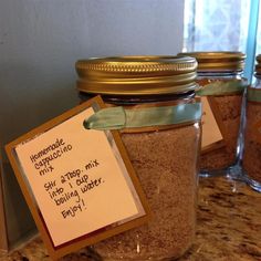 three jars filled with brown sugar sitting on top of a counter