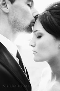 a man and woman kissing each other in front of a white background with the caption on