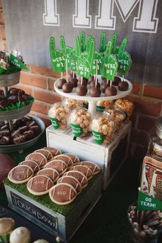 a table topped with lots of desserts and cookies