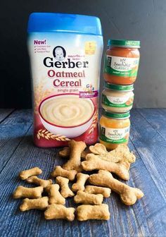 some dog treats are sitting on a table next to a bag of oatmeal