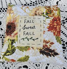 an embroidered pillow with the words fall sweet fall written on it and sunflowers