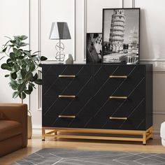 a black and gold dresser in a living room