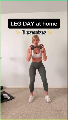 a woman in grey leggings and white top holding a barbell with the words leg day at home