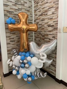 an inflatable balloon bouquet with a cross on it