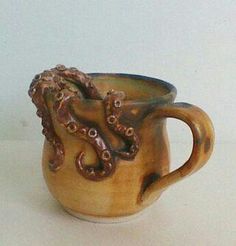 a ceramic cup with an octopus on it