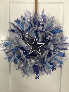 a blue and silver wreath with a star on it