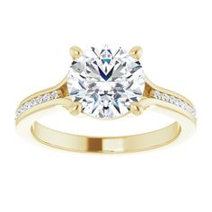 a yellow gold engagement ring with an oval cut diamond in the center and side stones