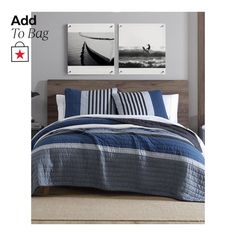 a bed with blue and white striped comforter next to two pictures on the wall