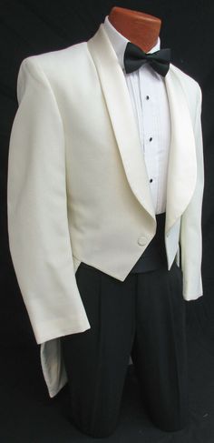 NEW IVORY TUXEDO TAILCOAT Two Button Front with Satin Shawl Lapels. Traditional Tails in the Back. Durable & Machine Washable Polyester. High Quality Made in the USA! Please note these feature a zipper inside the coat underneath the lapels.  Not visible while worn I just thought I should mention it.  Listing is for the tailcoat only.  Please visit my eBay Store if you are interested in additional formal wear items. Elegant Single Breasted Tuxedo For Wedding, Elegant Single Button Wedding Tuxedo, Elegant Single-breasted Tuxedo For Wedding, Elegant Single-breasted Wedding Tuxedo, Classic Single-button Wedding Tuxedo, White Fitted Ceremony Outerwear, Fitted White Outerwear For Ceremony, Classic Beige Outerwear For Wedding, Wedding Tuxedo Outerwear With Single Button