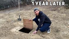 a man kneeling down next to a hole in the ground that says, 1 year later