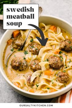 a bowl of swedish meatball soup with noodles and carrots