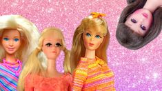 three barbie dolls standing next to each other on a pink and purple glittered background