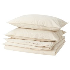 three pillows stacked on top of each other