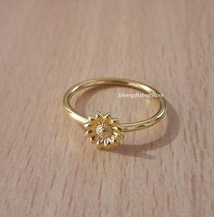 18K Gold Plated Sunflower Ring, Minimalist Floral Ring ,Handmade Ring, Trendy Ring, Dainty Ring, Ring For Women, Gold Plated Sunflower Ring. my shop name - SilvergiftshopStore All my Designs are original. ✔ Handmade ✔ Metal: 925 Sterling Silver, Gold ✔ Color: Yellow Gold Plated & Natural Silver Available in 14K Gold vermeil, rose gold, natural silver, and black oxidized. You can also customize this design. Worldwide shipping now available 4 to 5 business days 🛠 All pieces are handcrafted to order, please allow up to 1-2 weeks for the item to ship. Need it sooner? Just ask and we will let you know if it's possible Note: All weights and dimensions are approximate. Exact dimensions, metal weight, and carat weight vary between jewelry. All metal weights are based on jewelry design. Made of so Silver Floral Jewellery, Ring For Women Gold, Sunflower Ring, Shop Name, Dainty Gold Rings, Zierlicher Ring, Floral Ring, Trendy Ring, Ring Minimalist