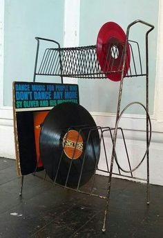 a rack with vinyl records and a record player