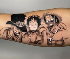 one piece tattoo on the arm with two people wearing hats and holding hands in front of each other