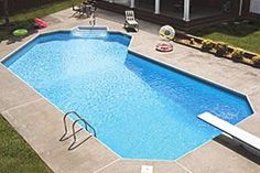 an above ground swimming pool surrounded by lawn chairs