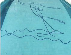 a swimming pool with a drawing on the side