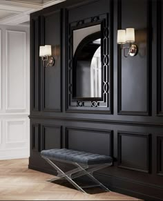 a black cabinet with a mirror and bench in front of it