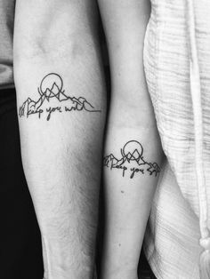 two people with matching tattoos on their legs