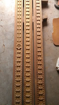 the train tracks are being worked on by some woodworkers in their workshop,