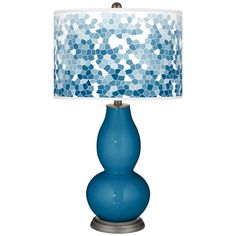 a blue table lamp with a white shade on it