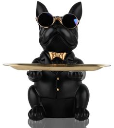 a statue of a dog wearing sunglasses and holding a plate