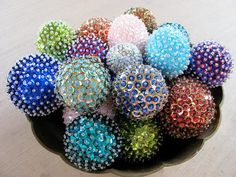 a bowl filled with lots of different colored balls