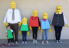 a group of people dressed up as legos standing in front of a garage door