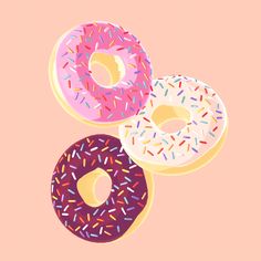 three donuts with sprinkles on a pink background