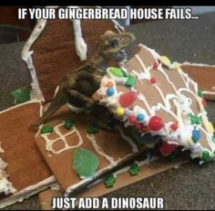 a gingerbread house that has been made to look like a dinosaur on top of it