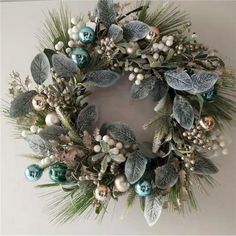 a christmas wreath is hanging on the wall