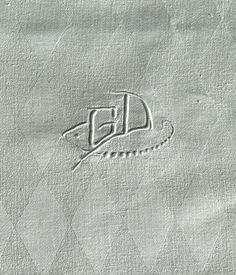 a close up of a piece of paper with the letter d on it and an image of a mouse