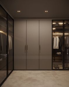 an empty walk in closet with glass doors