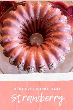 a pink bundt cake sitting on top of a white plate