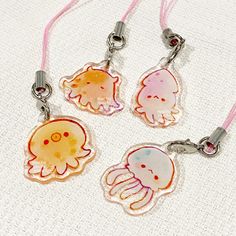 three little jelly fish charms on pink cord